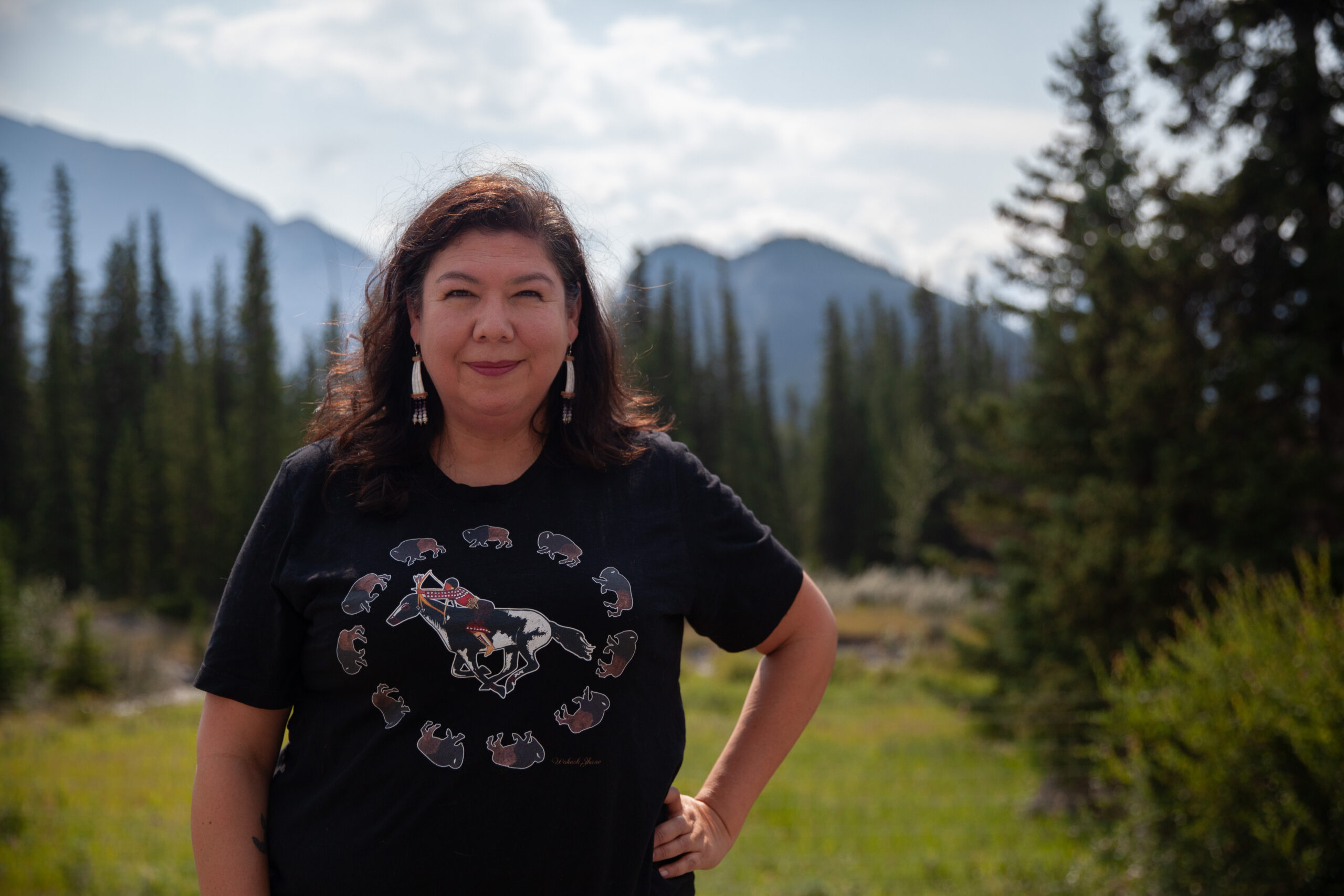Tasha Hubbard stands before Sleeping Buffalo Mountain, also known as Tunnel Mountain