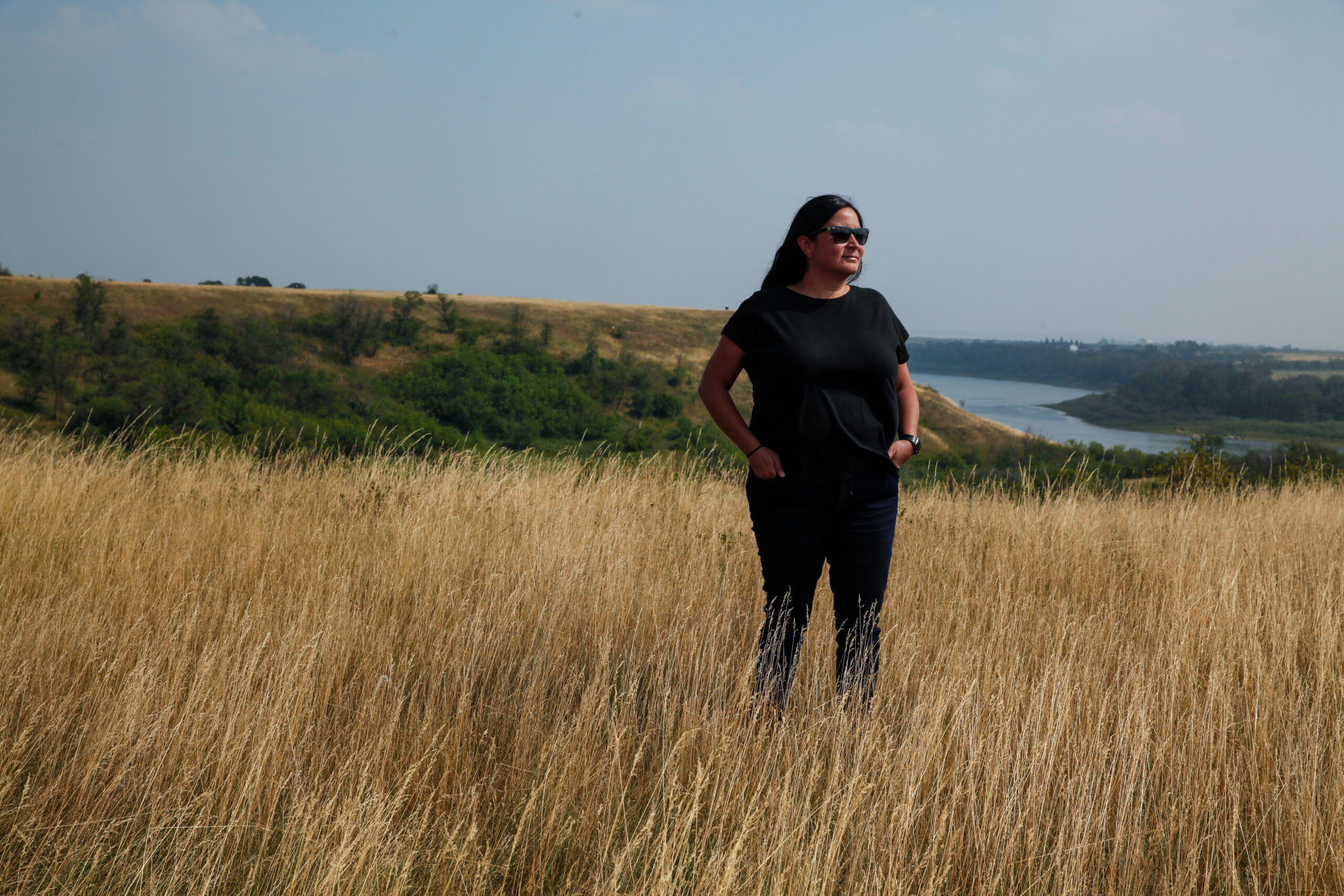 Melissa Arcand stands at newo asiniak, the Buffalo Jump at Wanuskewin, which means "Four Stones" in Cree